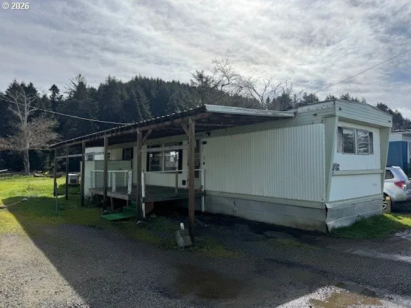 a view of a car park in front of a house