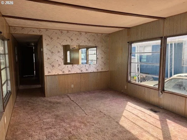 a view of an empty room with a window