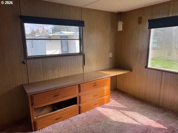 a bathroom with a shower and a sink