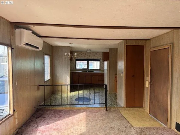 a kitchen with stainless steel appliances granite countertop a refrigerator and a stove