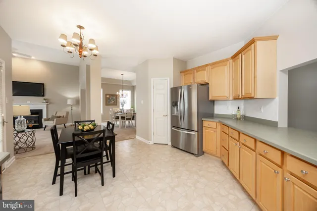 a view of a dining room with furniture and window