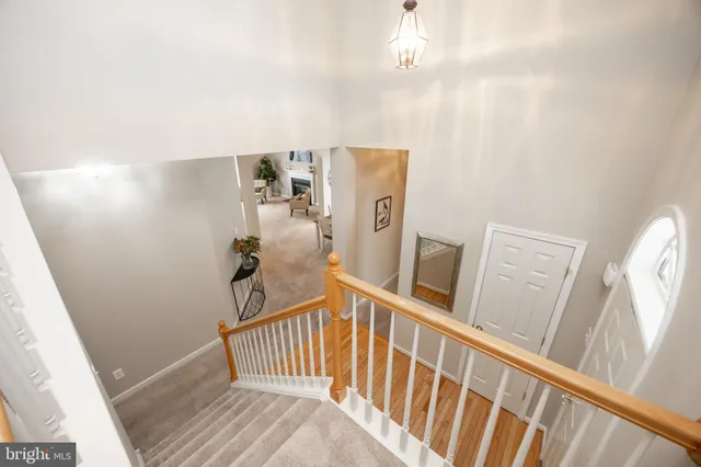 a spacious bedroom with a bed and a window