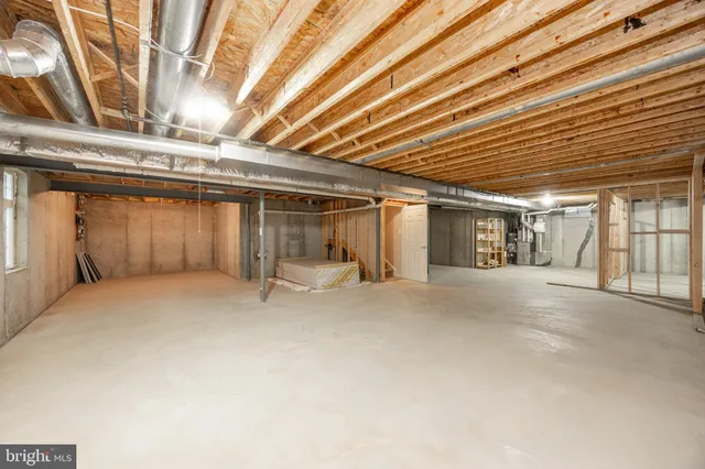 a view of an empty room with wooden walls