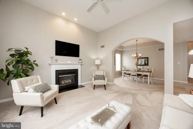 a living room with furniture fireplace and a flat screen tv
