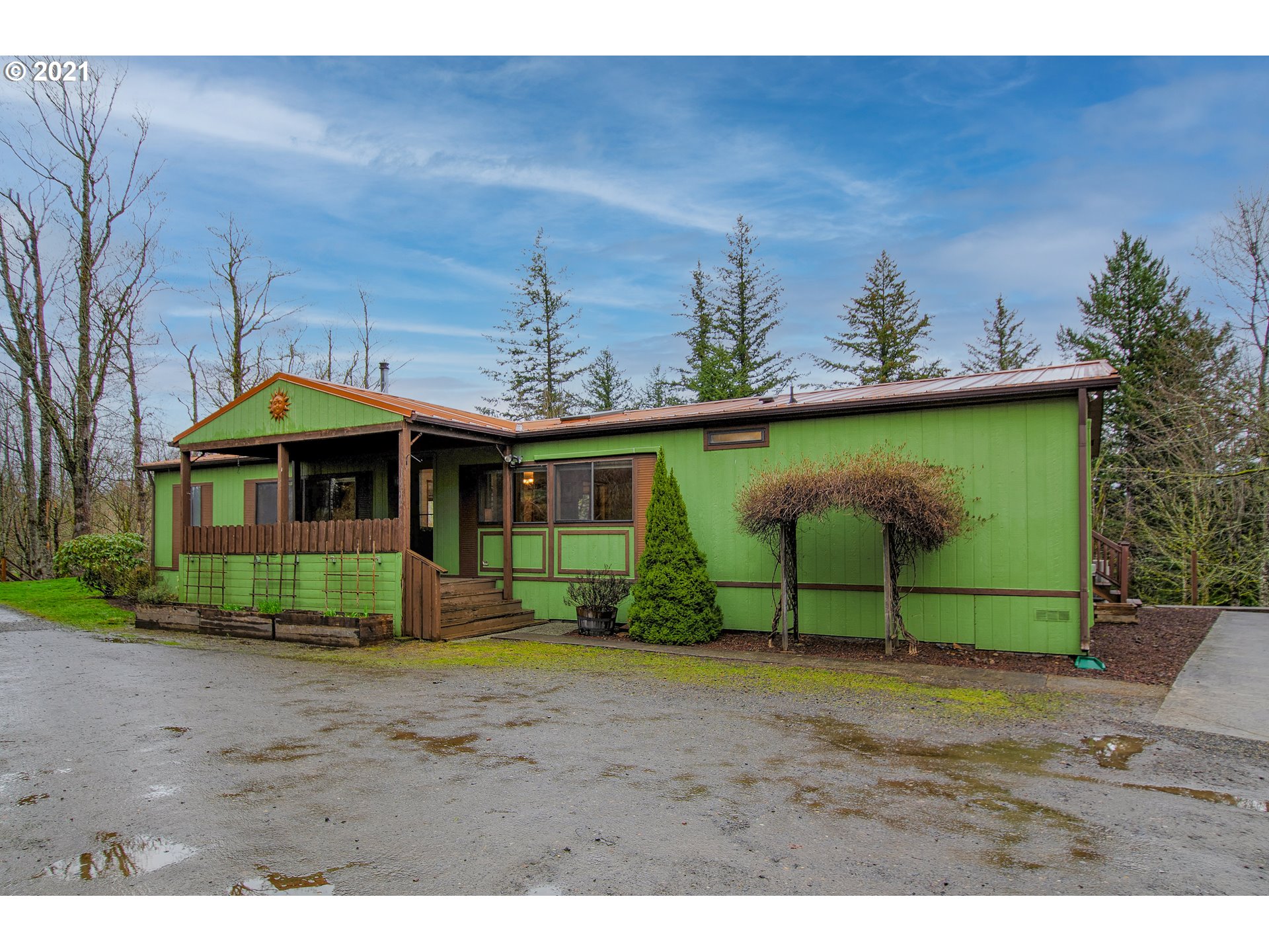 509 Northeast Pounder Road Corbett, OR 97019 - Photo 1 of 32 a front view of a house with garden