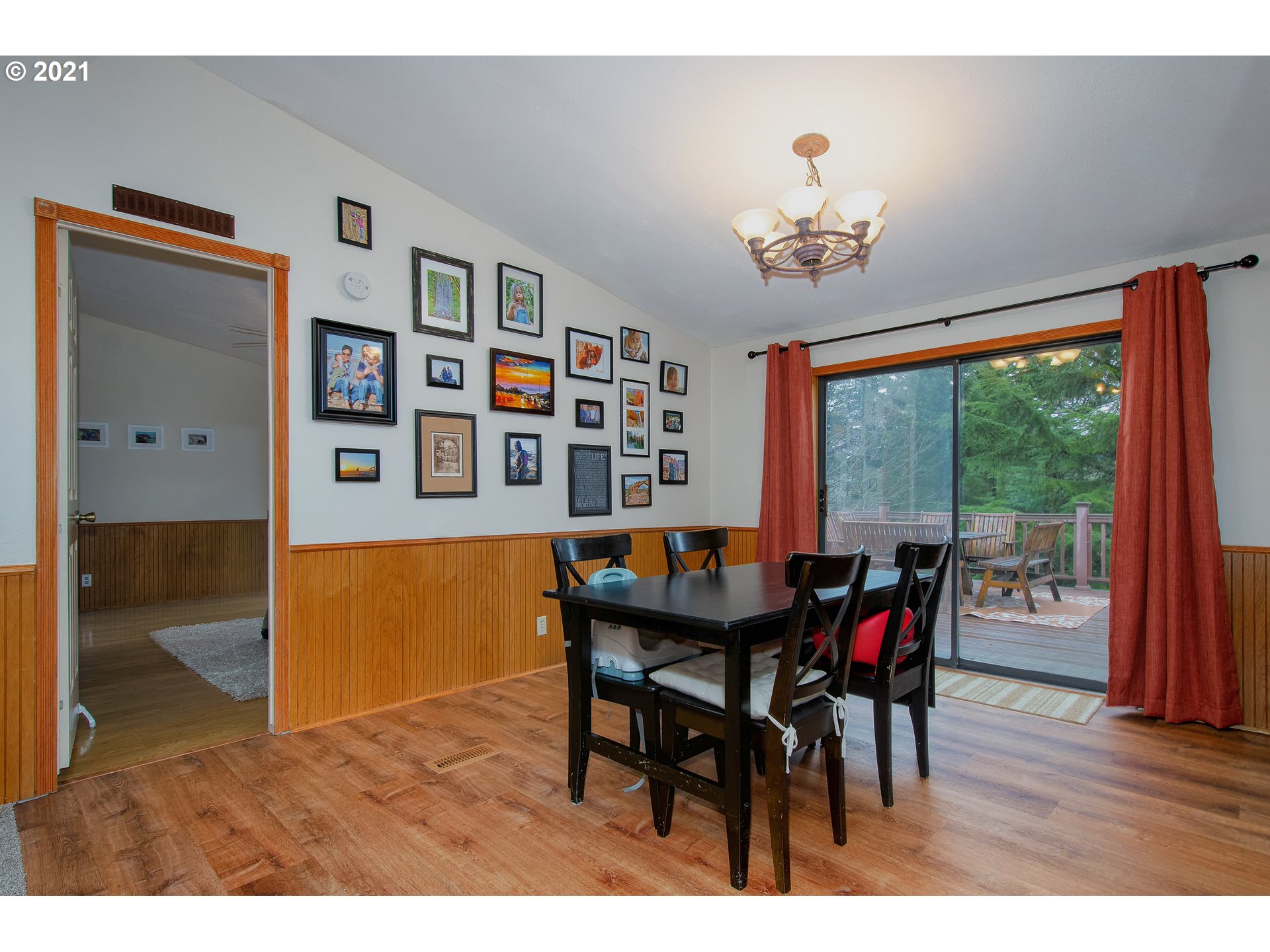 509 Northeast Pounder Road Corbett, OR 97019 - Photo 8 of 32 a view of a dining room with furniture window and wooden floor