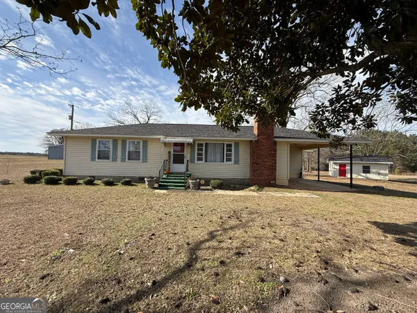 front view of a house with a yard