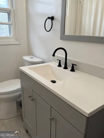 a bathroom with a sink and a toilet
