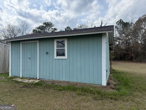 a view of a wooden fence