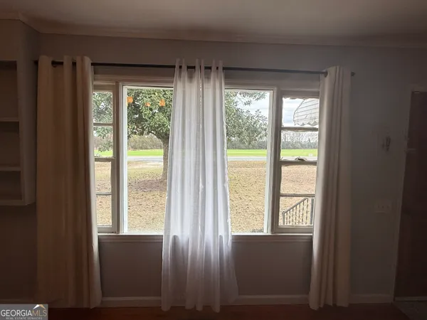 a view of an empty room and window