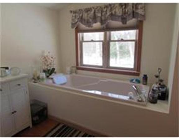 11 Griffing Road West Brookfield, MA 01585 - Photo 8 of 30 a bath tub sitting in a bathroom next to a window