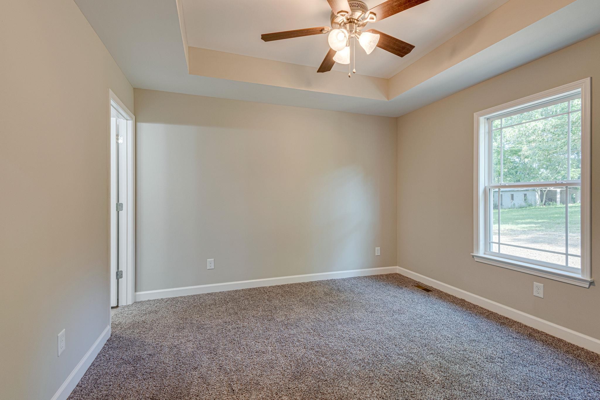 400 Kaiser Road Dickson, TN 37055 - Photo 11 of 11 an empty room with windows and fan