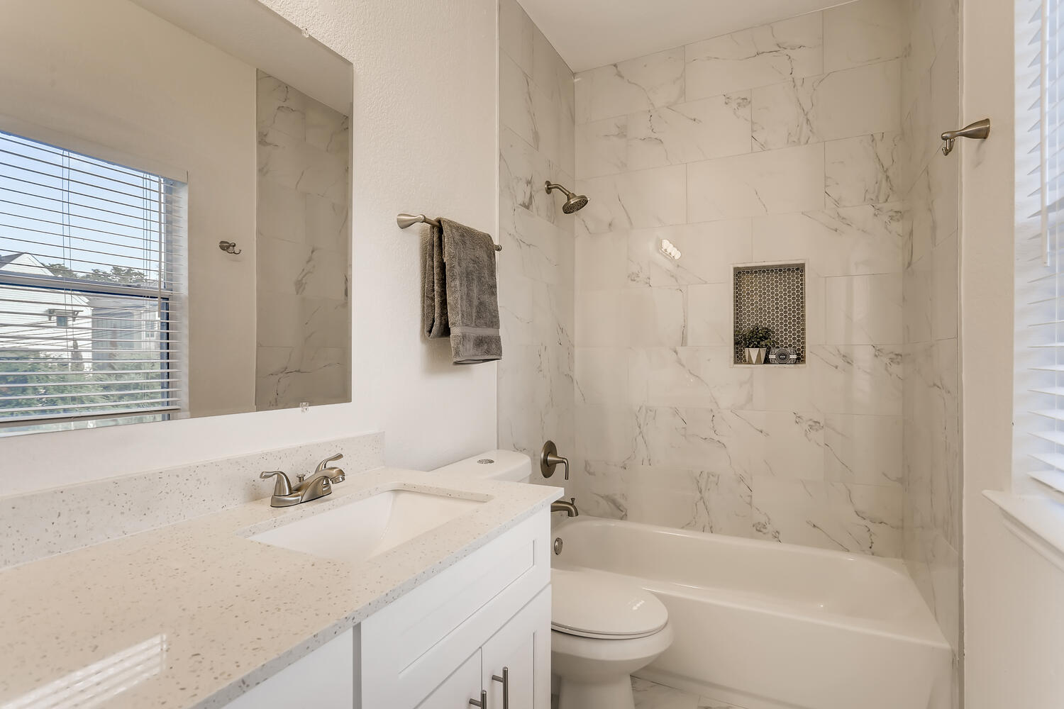 1206 Maple Avenue Austin, TX 78702 - Photo 13 of 39 a bathroom with a bathtub shower sink vanity mirror and toilet