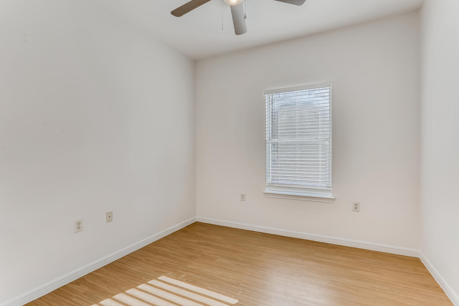 1206 Maple Avenue Austin, TX 78702 - Photo 15 of 39 a view of an empty room with wooden floor and a window