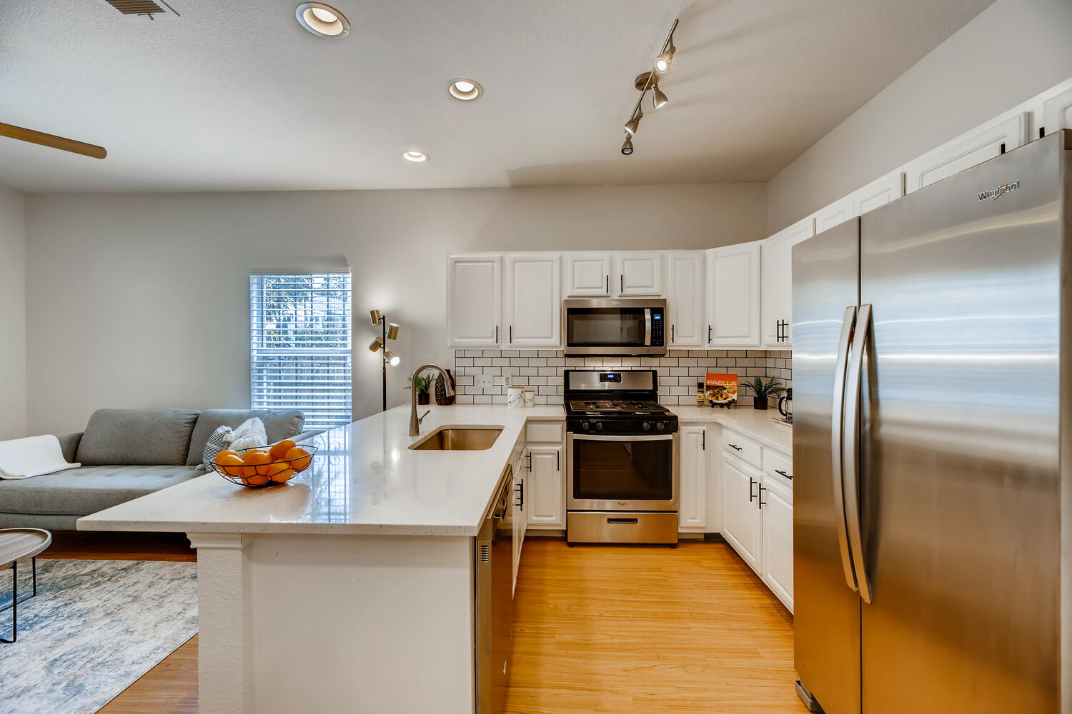 1206 Maple Avenue Austin, TX 78702 - Photo 28 of 39 a kitchen with stainless steel appliances refrigerator stove microwave and sink