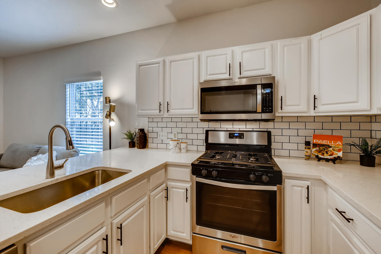 1206 Maple Avenue Austin, TX 78702 - Photo 29 of 39 a kitchen with cabinets stainless steel appliances and a sink