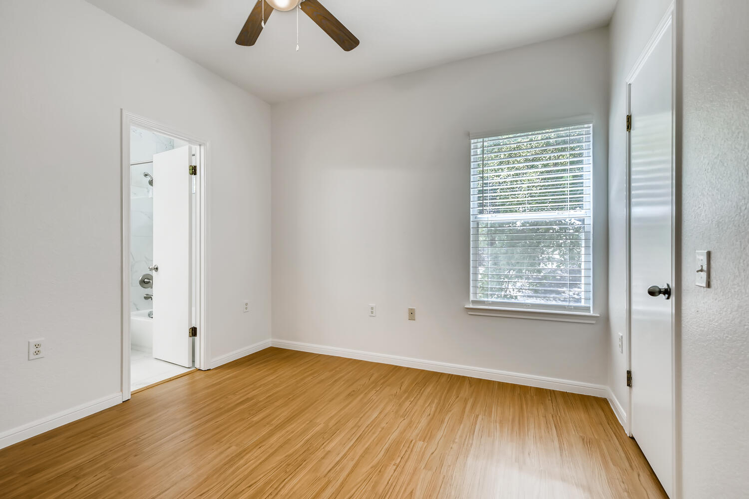 1206 Maple Avenue Austin, TX 78702 - Photo 33 of 39 wooden floor in an empty room with a window
