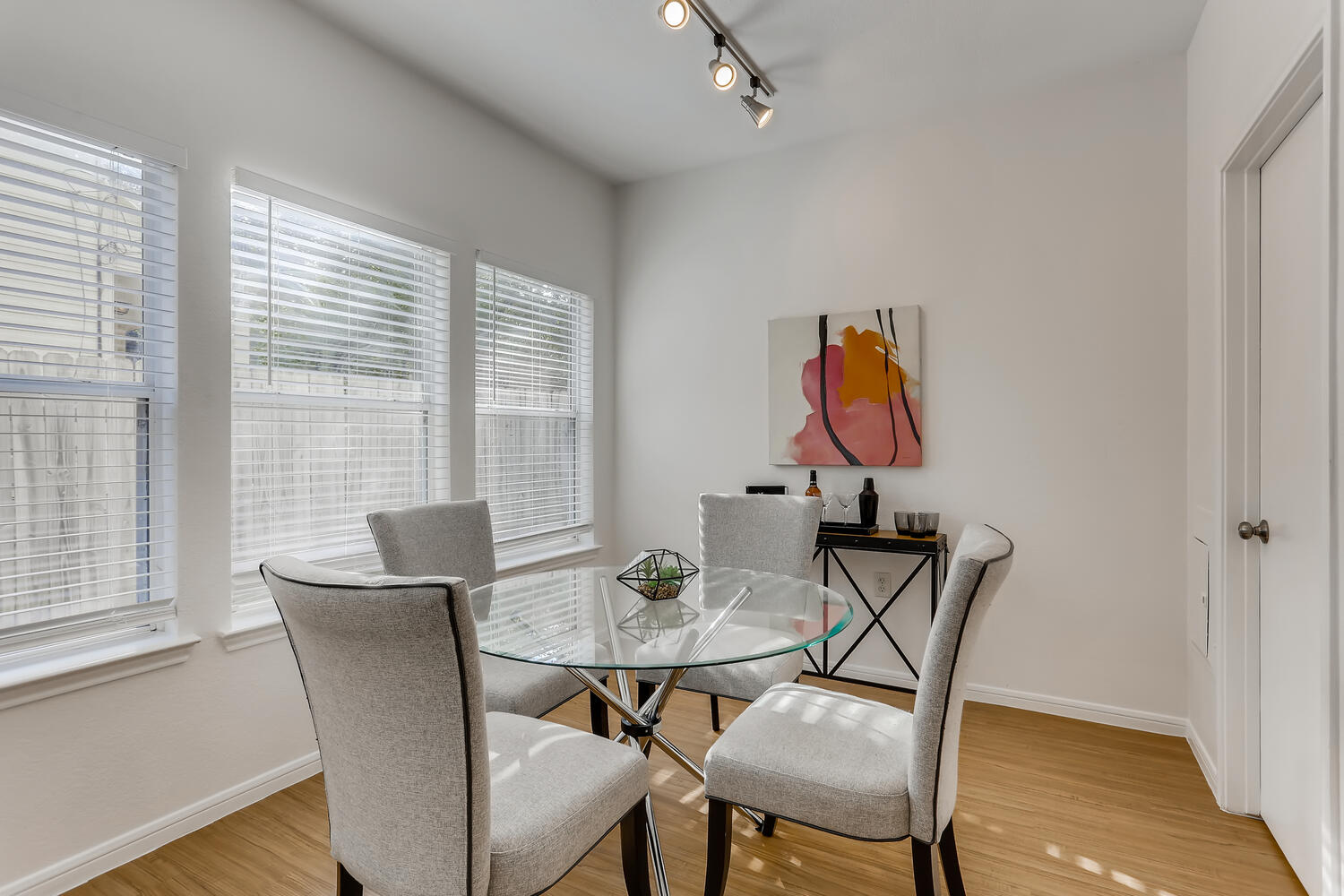 1206 Maple Avenue Austin, TX 78702 - Photo 5 of 39 a view of a dining room with furniture window and wooden floor