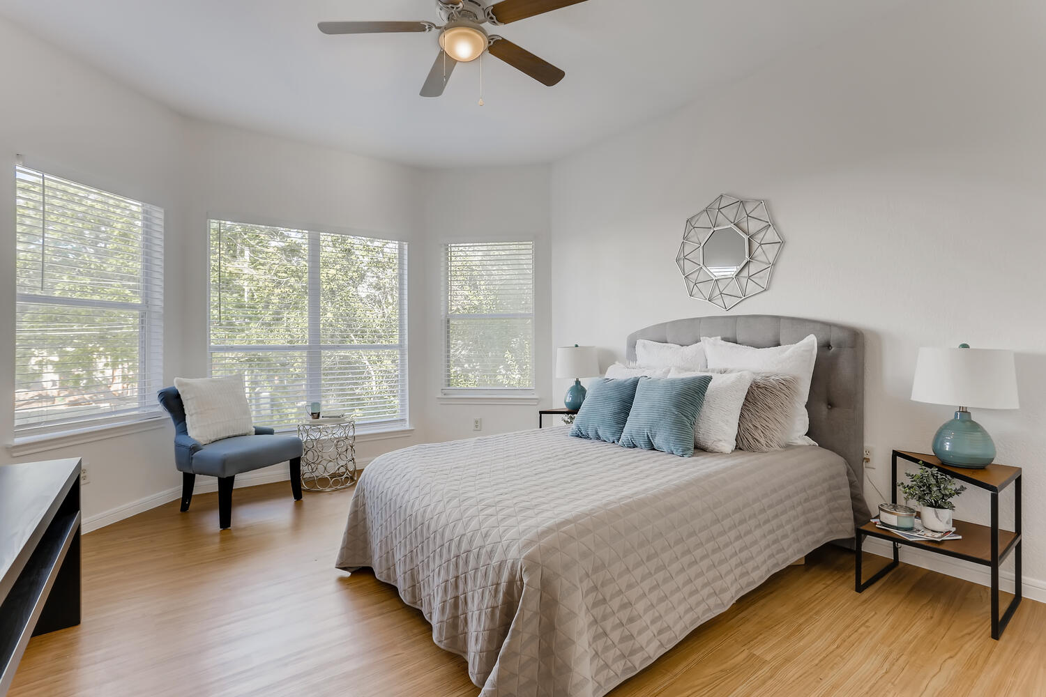 1206 Maple Avenue Austin, TX 78702 - Photo 10 of 39 a bedroom with a bed and a lounge chair