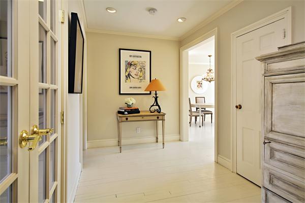 37 Beacon Street, Unit 51 Boston, MA 02108 - Photo 2 of 7 a view of a hallway with paintings on the wall