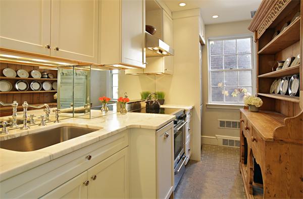 37 Beacon Street, Unit 51 Boston, MA 02108 - Photo 3 of 7 a view of a kitchen with a sink and cabinets