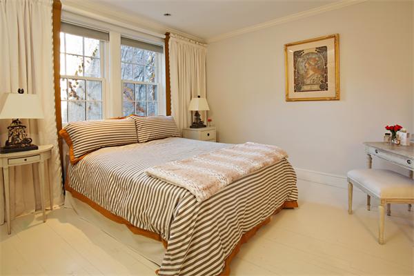 37 Beacon Street, Unit 51 Boston, MA 02108 - Photo 4 of 7 a bedroom with a bed and a painting on the wall