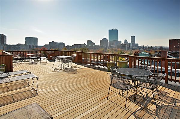 37 Beacon Street, Unit 51 Boston, MA 02108 - Photo 7 of 7 a view of a terrace with wooden benches