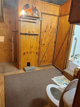 a backyard of a house with barbeque oven