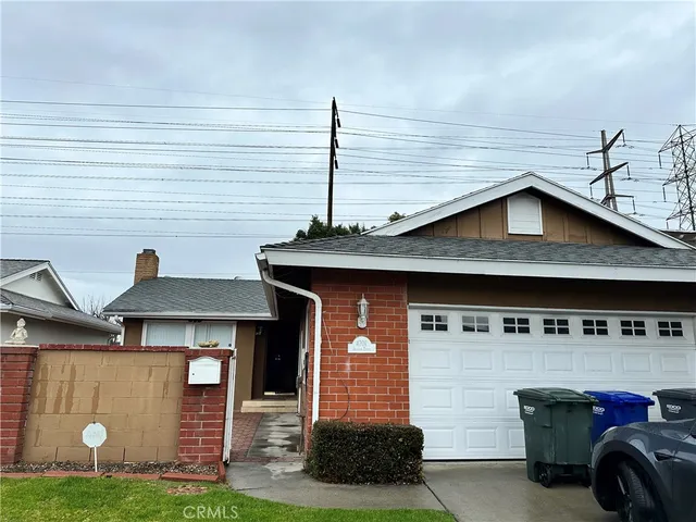 a front view of a house with garage