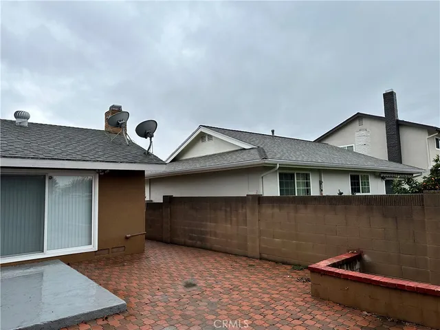 a front view of a house with parking space