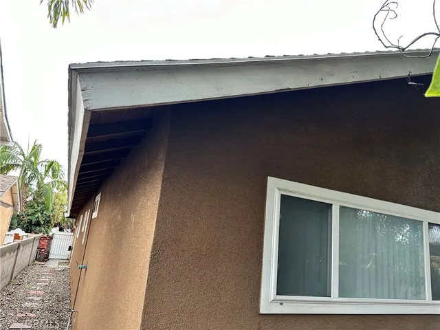 a kitchen with granite countertop a stove and a refrigerator
