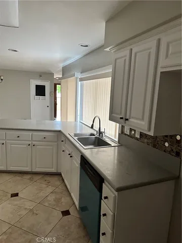 a view of a livingroom with furniture and flat screen tv