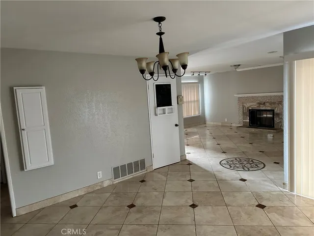 a kitchen with a sink a refrigerator and cabinets