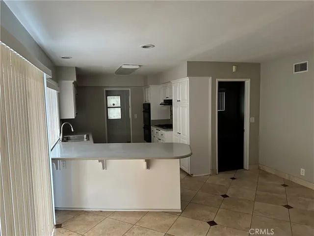 a view of living room with furniture and a flat screen tv