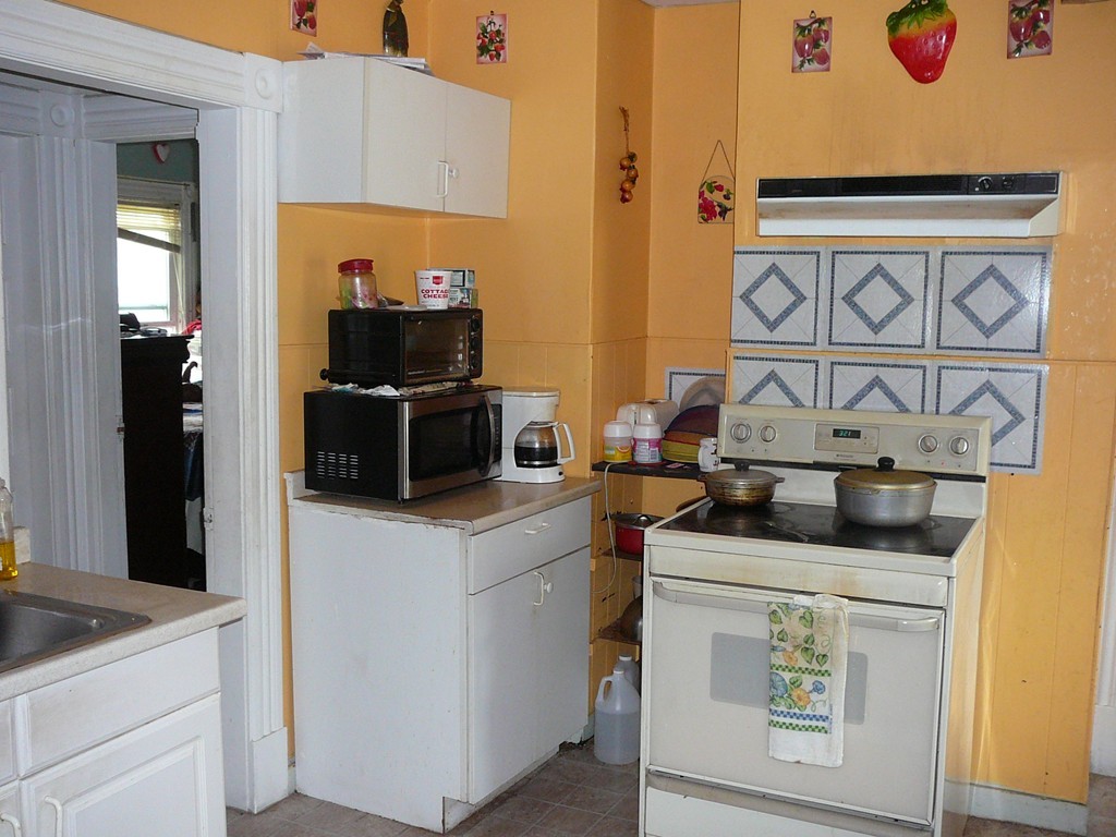 40 Revere Street Springfield, MA 01108 - Photo 15 of 21 a kitchen with stainless steel appliances granite countertop a stove and a sink