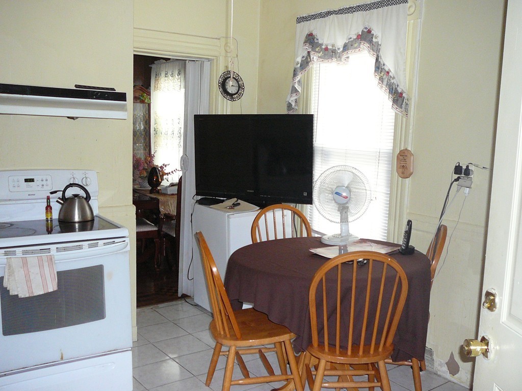 40 Revere Street Springfield, MA 01108 - Photo 2 of 21 a view of a livingroom with furniture window and wooden floor