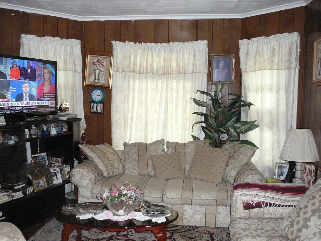 40 Revere Street Springfield, MA 01108 - Photo 6 of 21 a living room with furniture a lamp and a potted plant