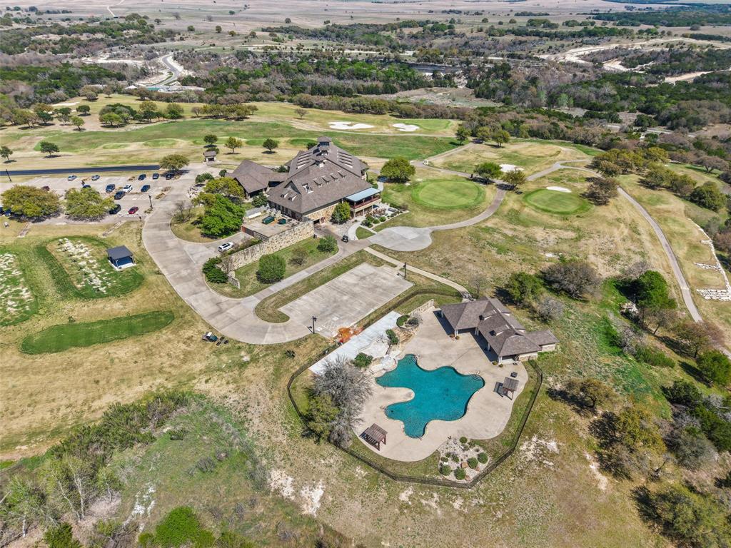 7513 St Andrews Loop Cleburne, TX 76033 - Photo 4 of 5 an aerial view of residential house with outdoor space