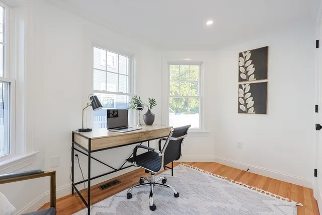 a workspace with furniture and window