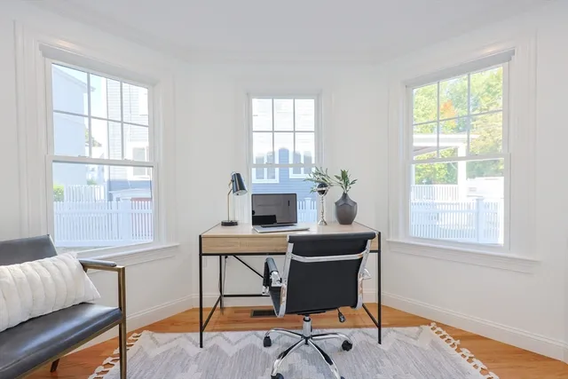 a dining room with furniture and window