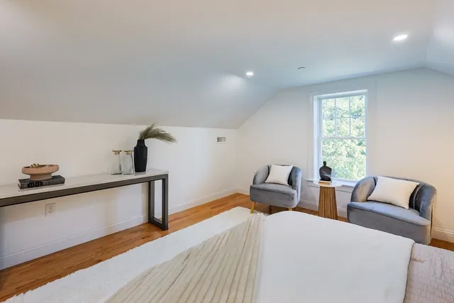 a bed room with two beds and a window