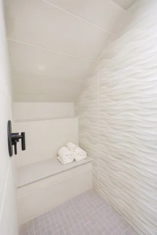 a bathroom with a white bathtub