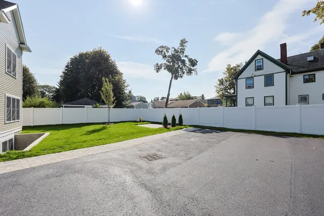 a view of backyard with small garden and plants