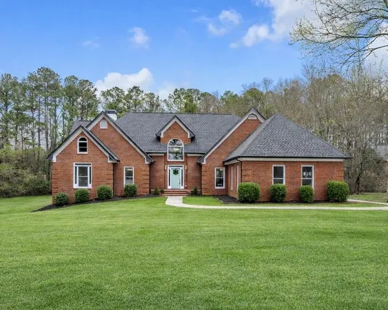 front view of a house with a yard
