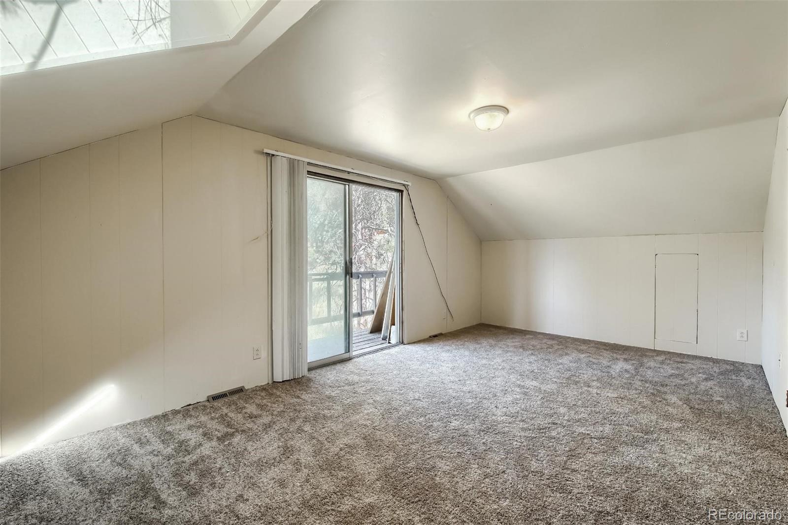 145 Bailey Drive Bailey, CO 80421 - Photo 21 of 40 an empty room with windows