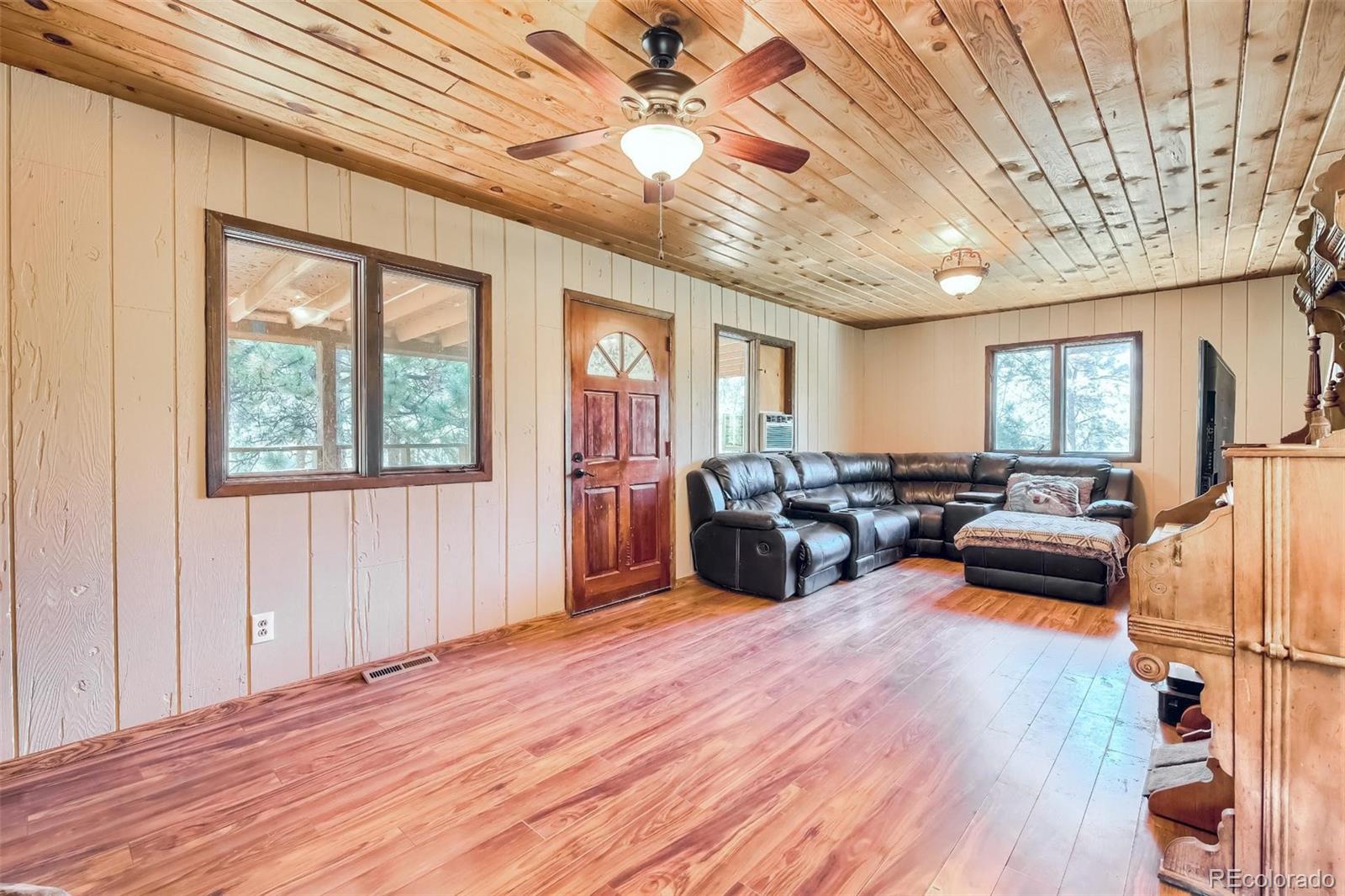 145 Bailey Drive Bailey, CO 80421 - Photo 5 of 40 a living room with furniture and a large window