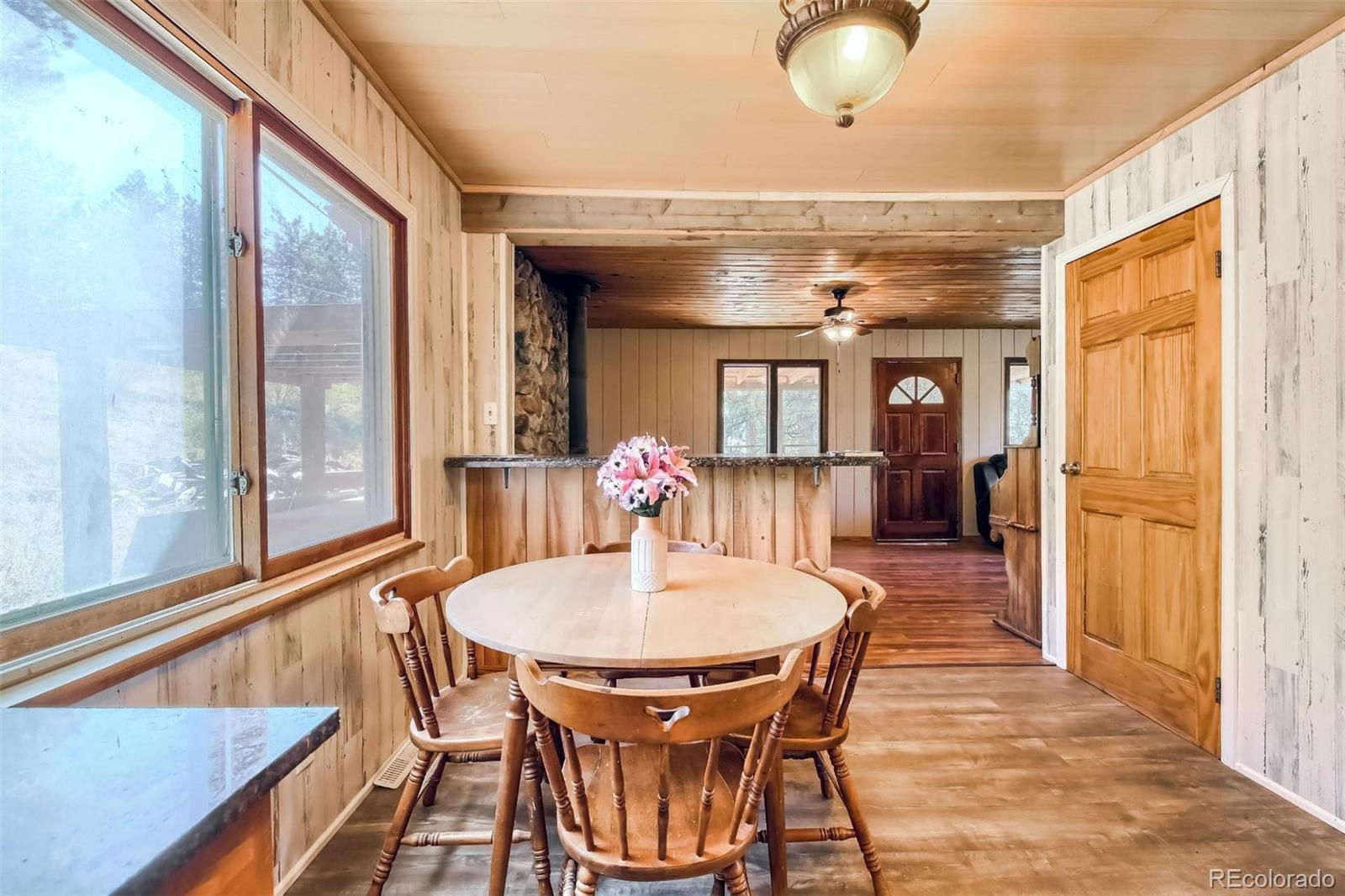 145 Bailey Drive Bailey, CO 80421 - Photo 9 of 40 a dining room with furniture and window