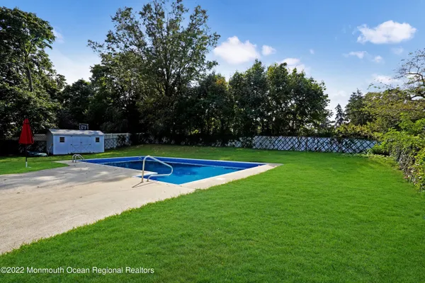 a view of a golf course with a swimming pool