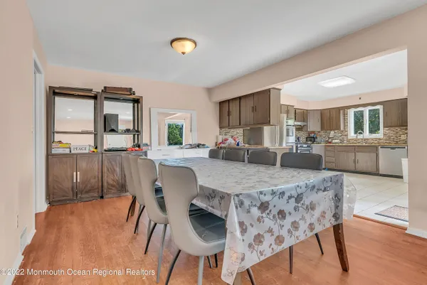 a view of a dining room with furniture and wooden floor