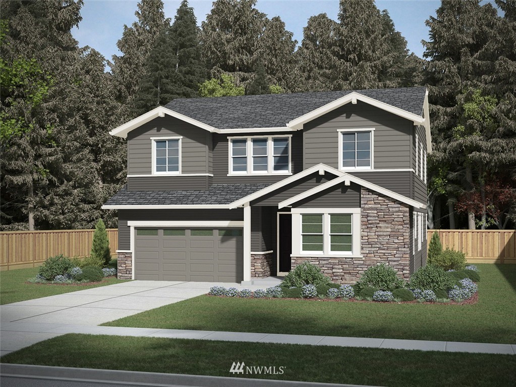 5015 Southeast 3rd Place Renton, WA 98059 - Photo 1 of 3 a front view of a house with a garden